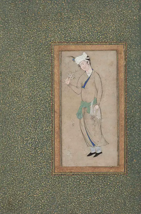 A young man carrying flowers
